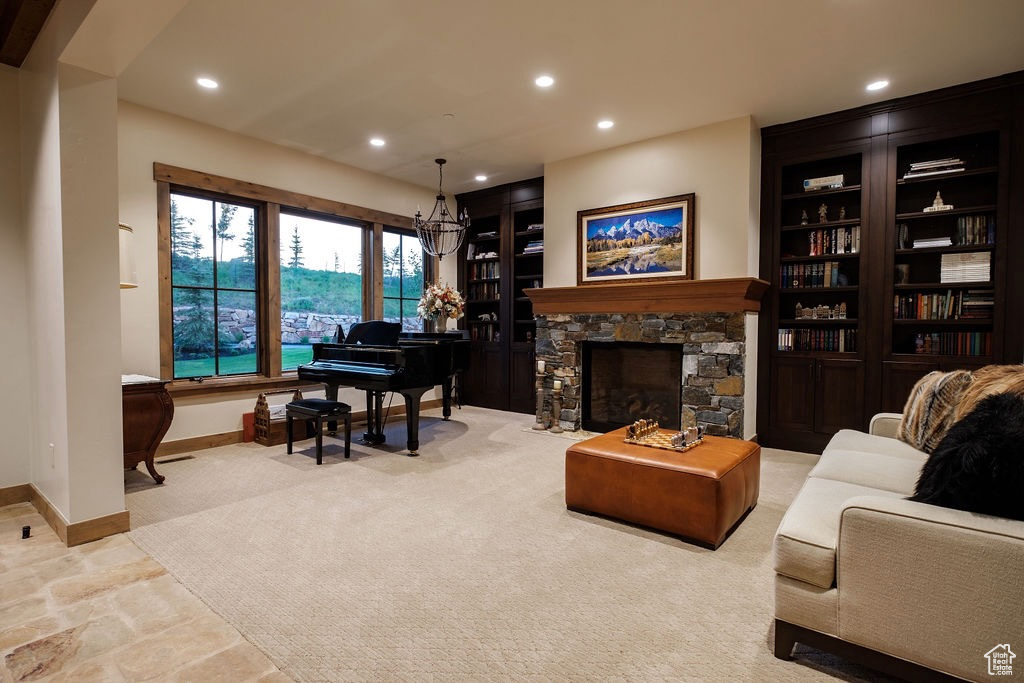 Living room featuring a fireplace and built in shelves