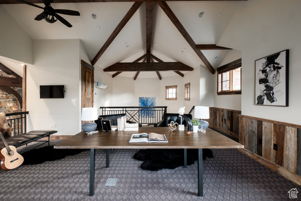 Carpeted office space with a ceiling fan
