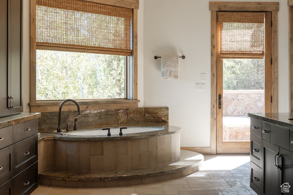 Full bath featuring a bath and vanity