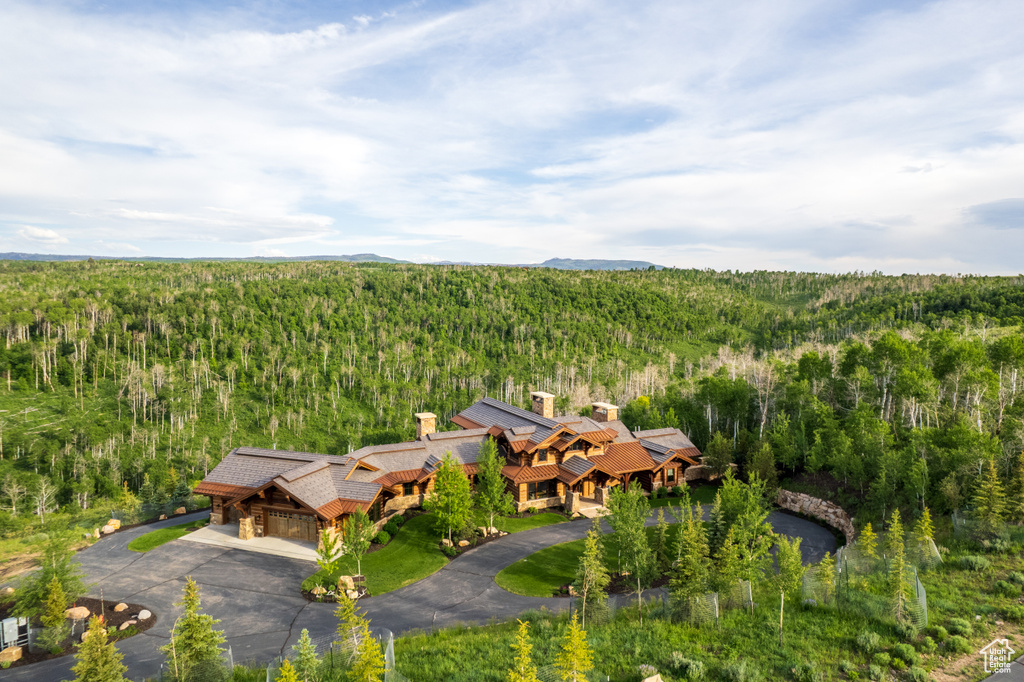 View from above of property featuring a heavily wooded area