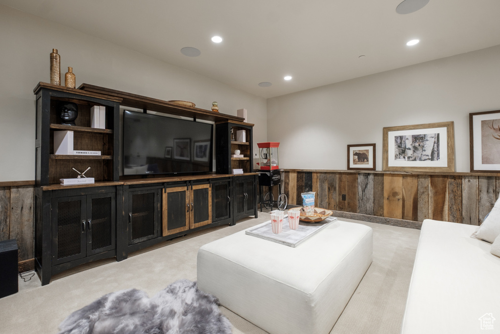 Living room with carpet floors, wainscoting, and recessed lighting