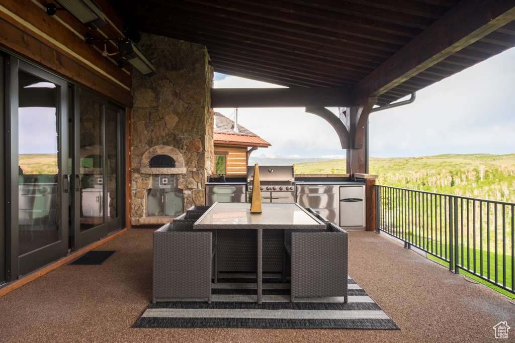 View of patio featuring area for grilling