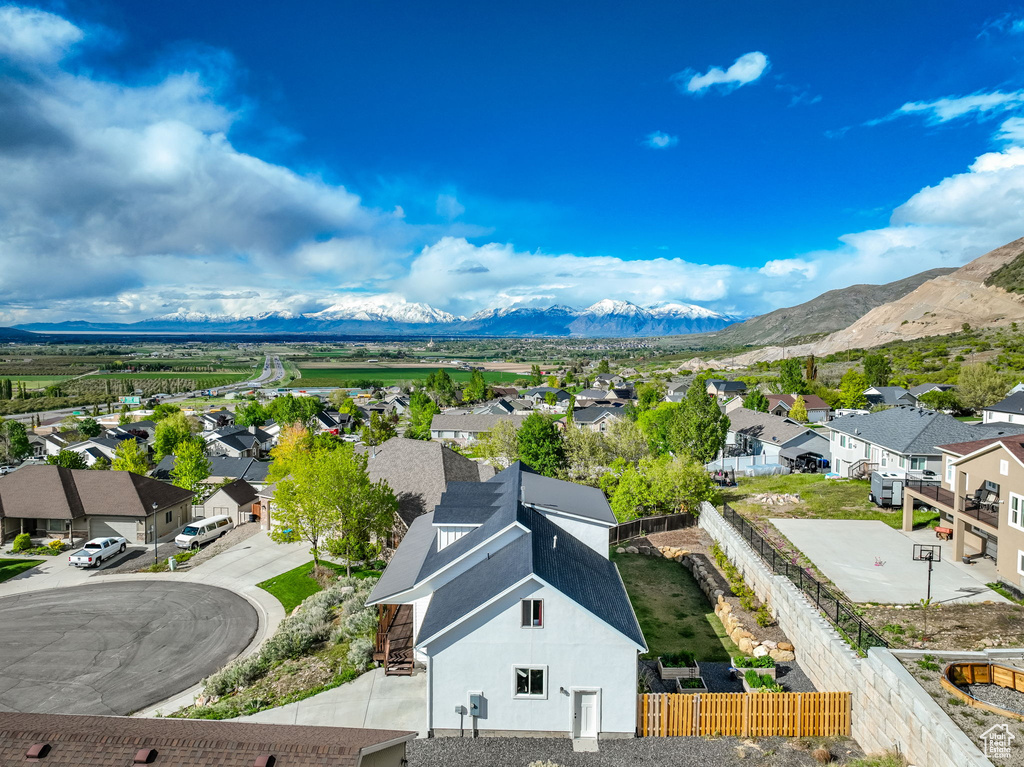 Birds eye view of property with a mountain view