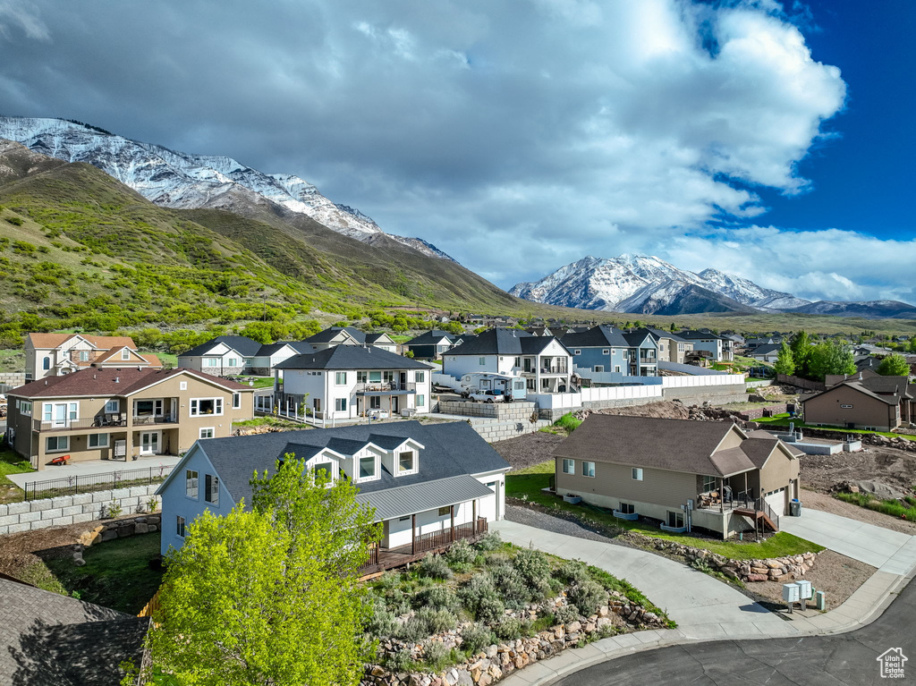 Birds eye view of property with a mountain view