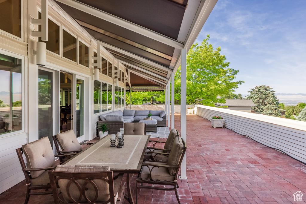 View of patio with an outdoor hangout area