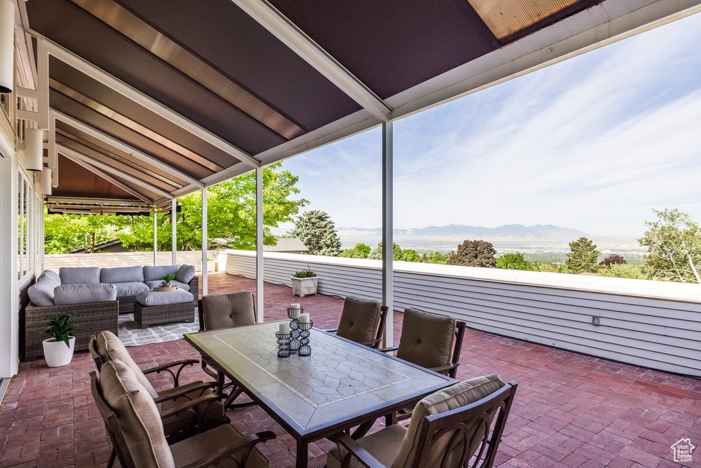 View of patio featuring outdoor lounge area and a mountain view