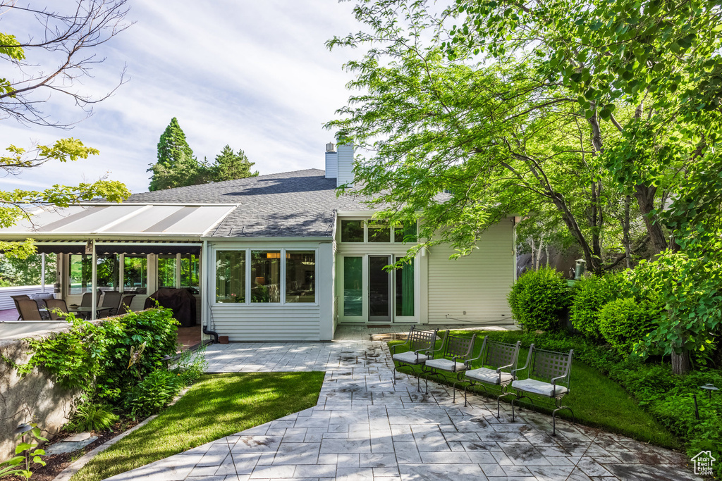 Rear view of house with a patio area