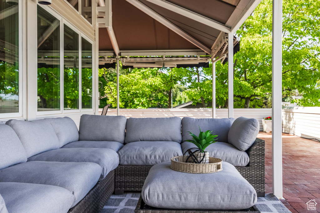 View of patio with an outdoor hangout area