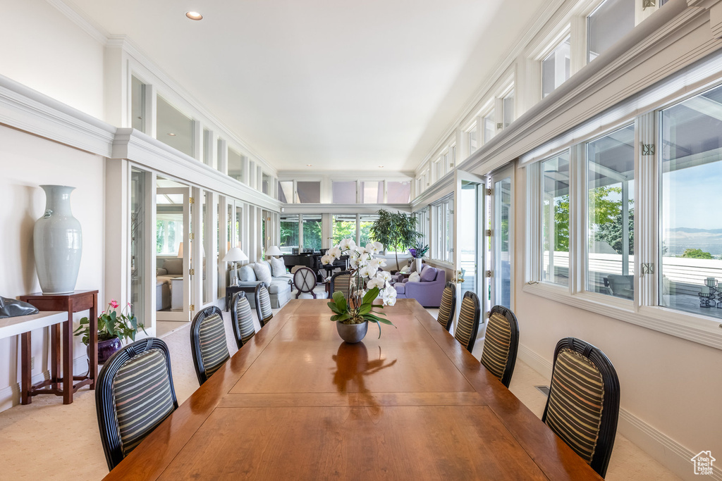 Dining area featuring crown molding