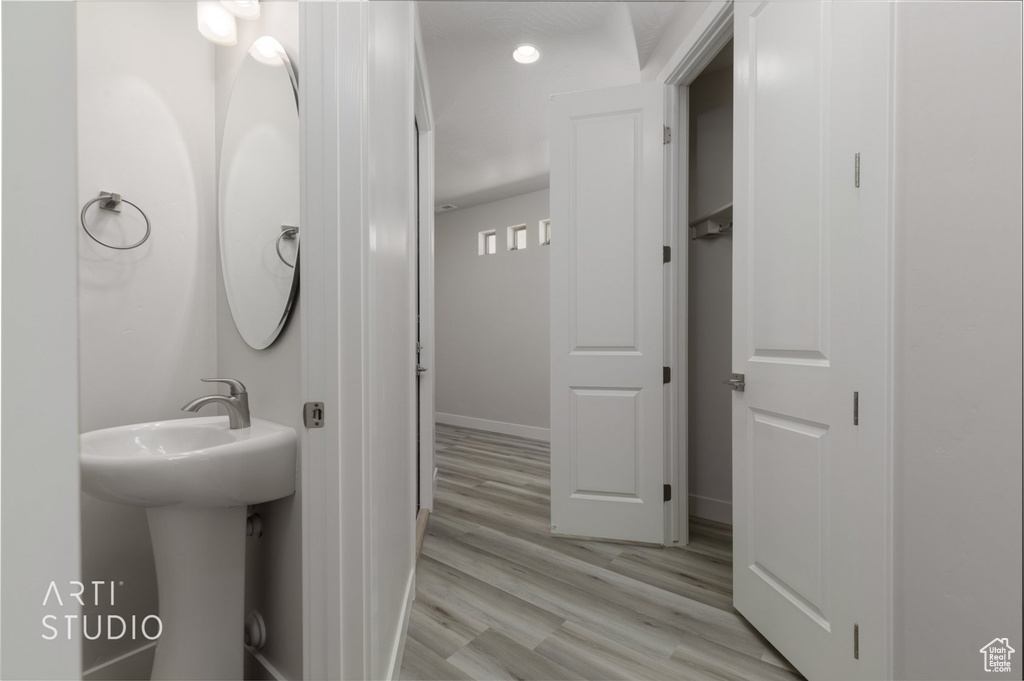 Bathroom with hardwood / wood-style floors