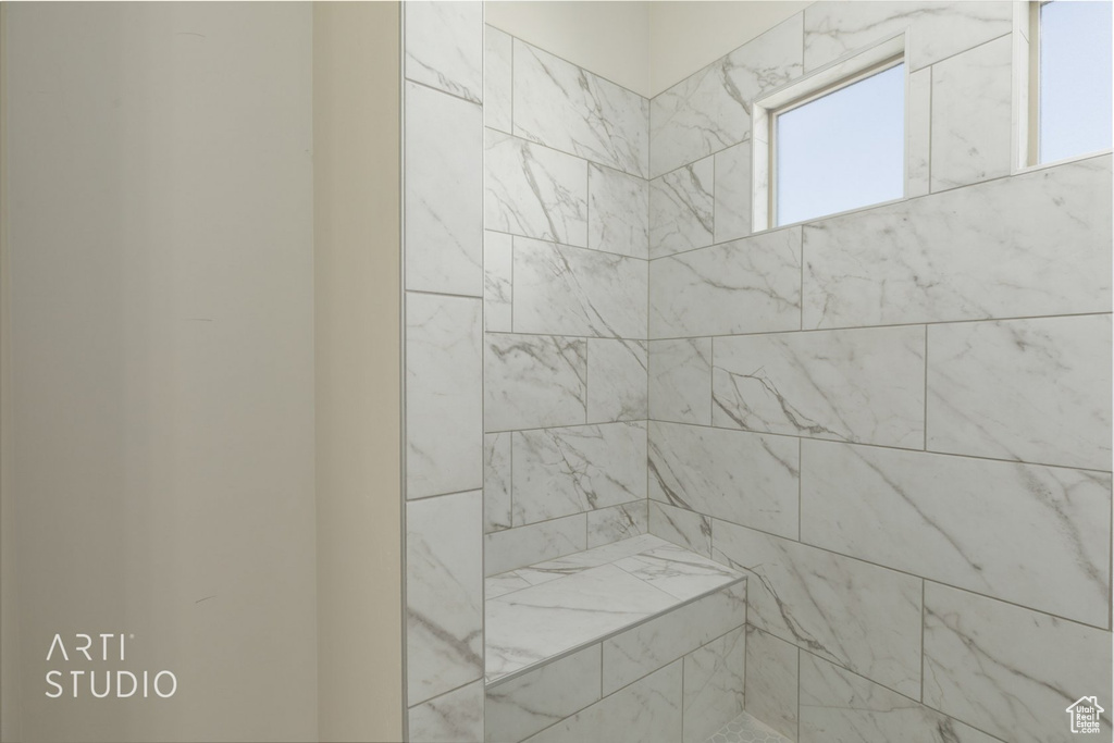 Bathroom featuring a tile shower