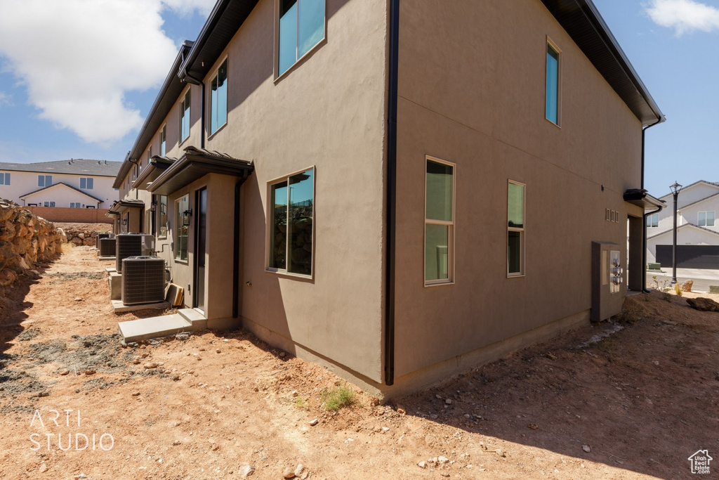 View of side of property featuring central AC unit