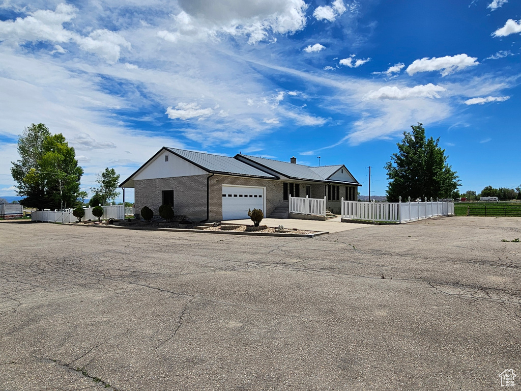 View of front of property featuring a garage