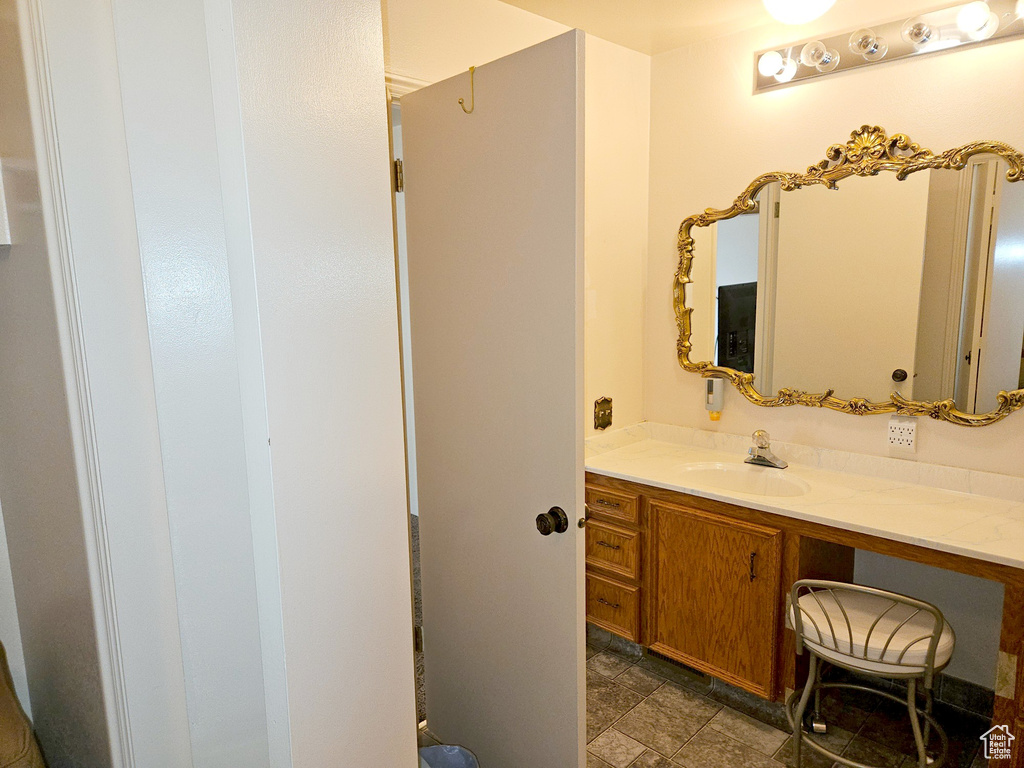 Bathroom featuring vanity and tile floors