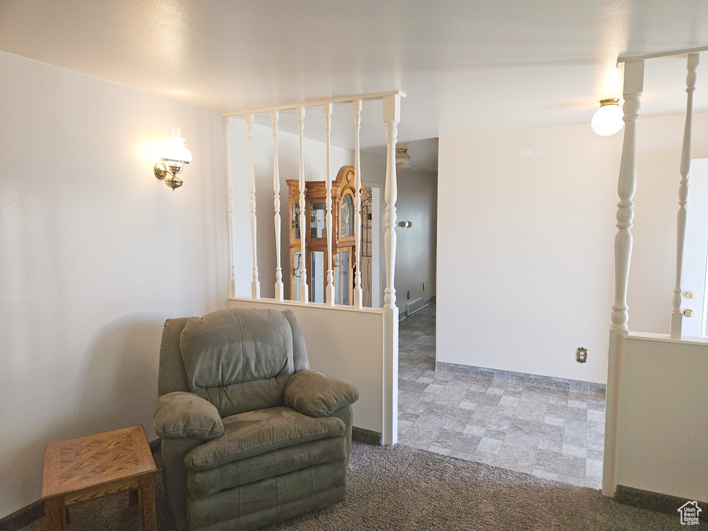 Living area featuring carpet flooring