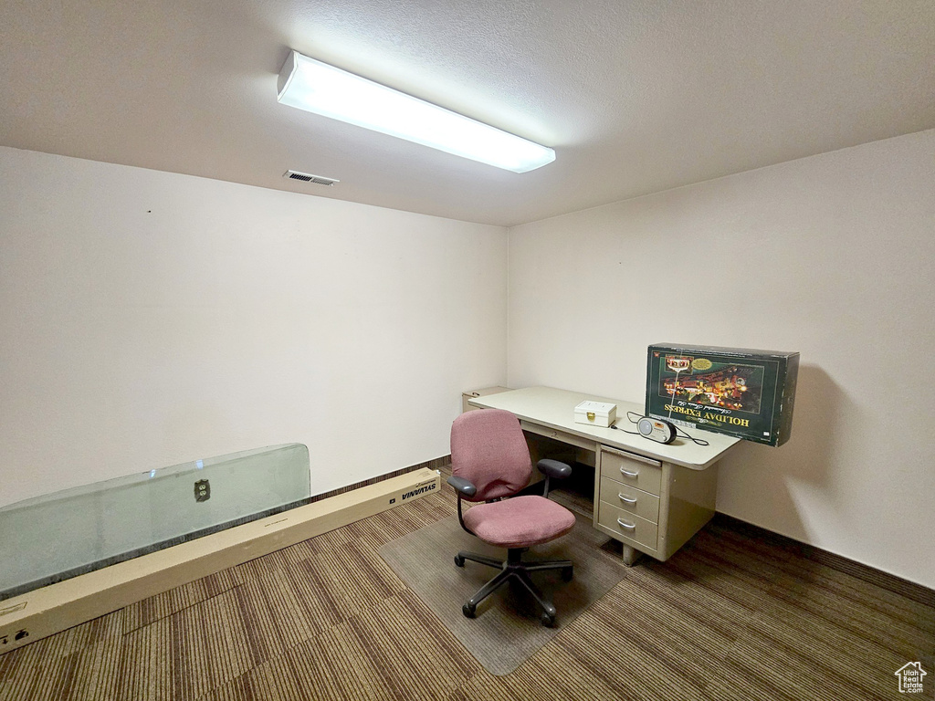 Office area featuring carpet flooring