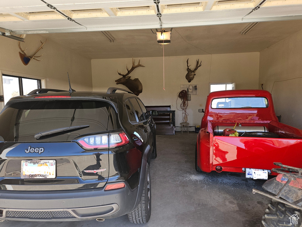 Garage featuring a garage door opener