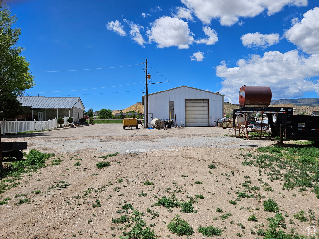 Exterior space with a garage and an outdoor structure