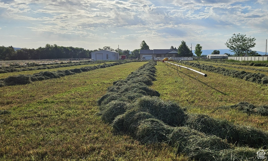 View of yard featuring a view of countryside and a garage