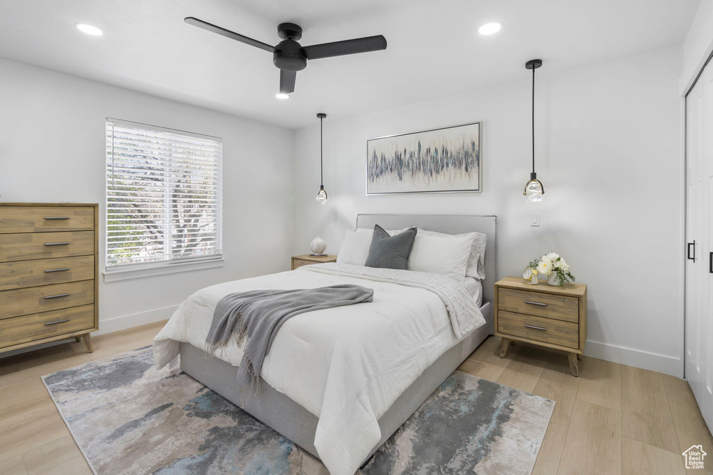Bedroom featuring ceiling fan and light wood-type flooring