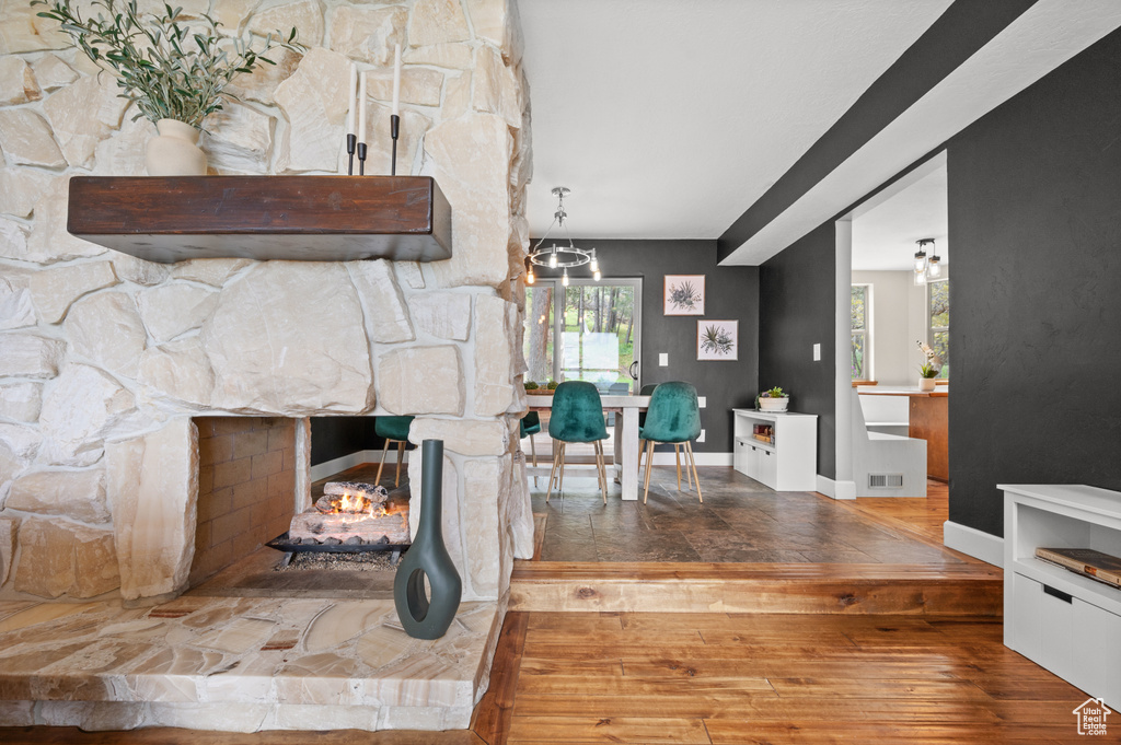 Interior space featuring a stone fireplace and tile flooring