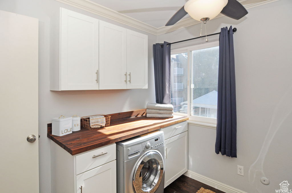 Laundry area with cabinets, ceiling fan, washer / dryer, crown molding, and dark hardwood / wood-style flooring