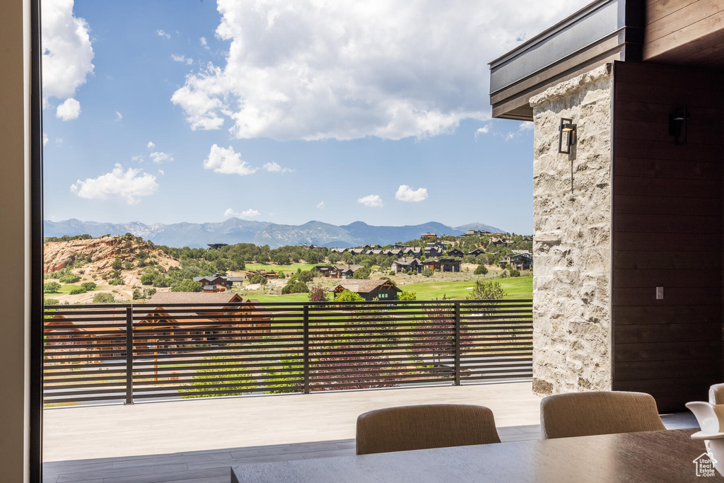 Exterior space featuring a balcony and a mountain view