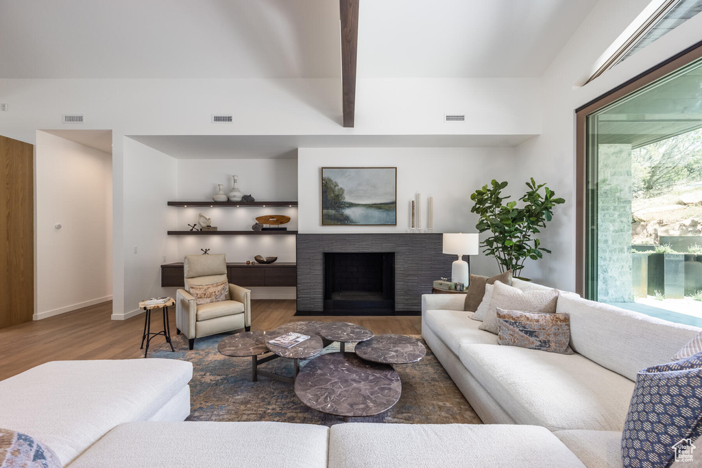 Living room with hardwood / wood-style flooring and plenty of natural light