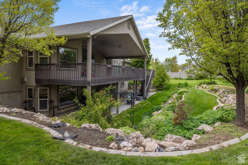 Exterior space featuring a patio area and a yard