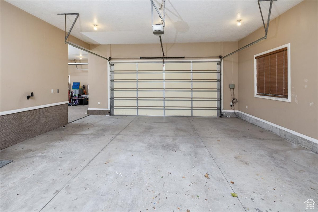 Garage featuring a garage door opener