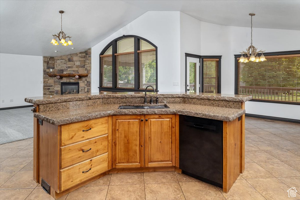 Kitchen featuring sink, an inviting chandelier, black dishwasher, and lofted ceiling