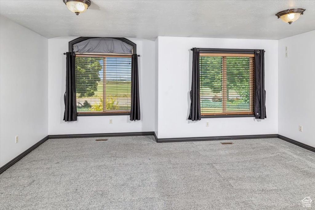 Empty room featuring carpet floors