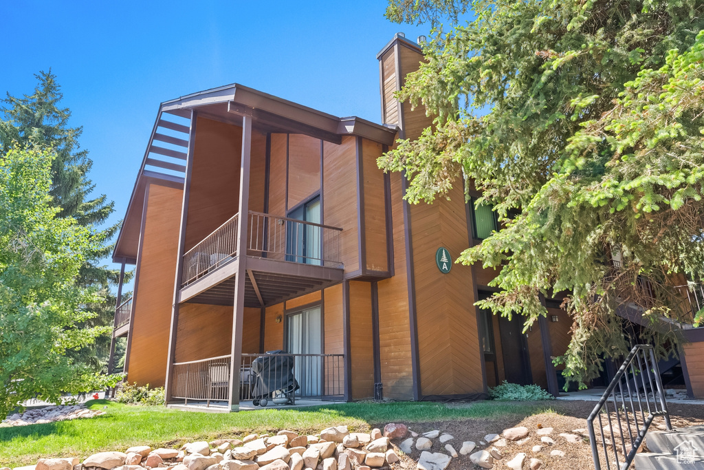 Rear view of house featuring a balcony