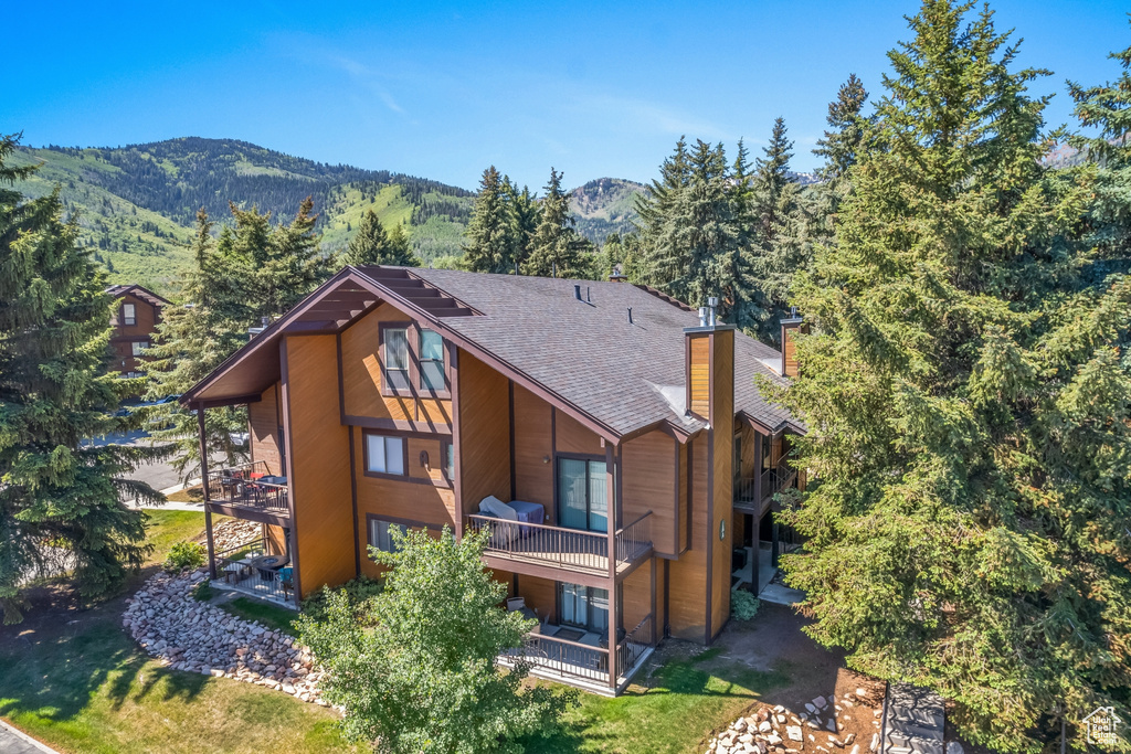 Exterior space with a mountain view and a balcony