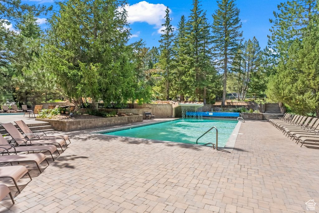 View of swimming pool featuring a patio area