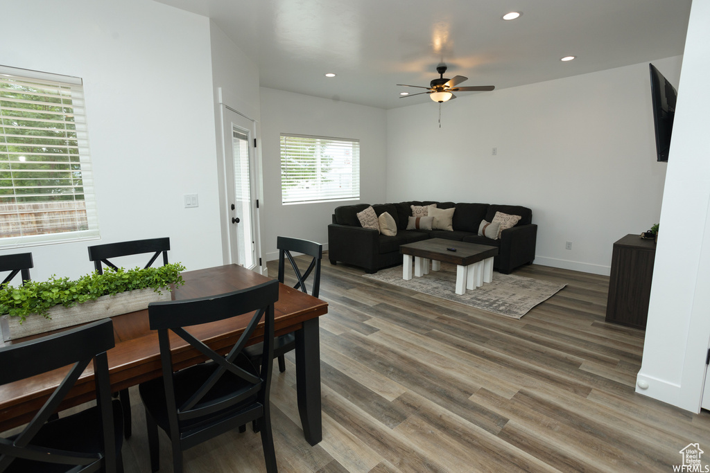 Dining area with ceiling fan and hardwood / wood-style floors