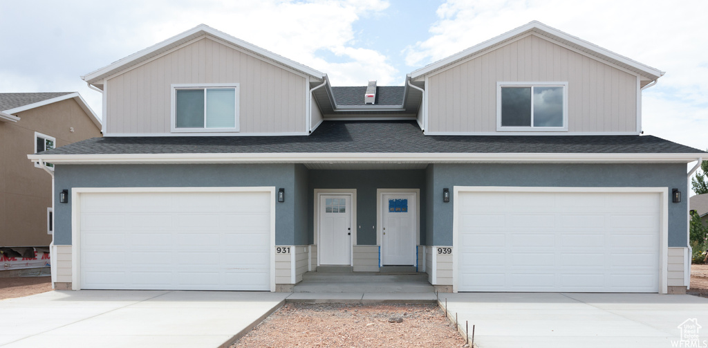 View of front of property featuring a garage