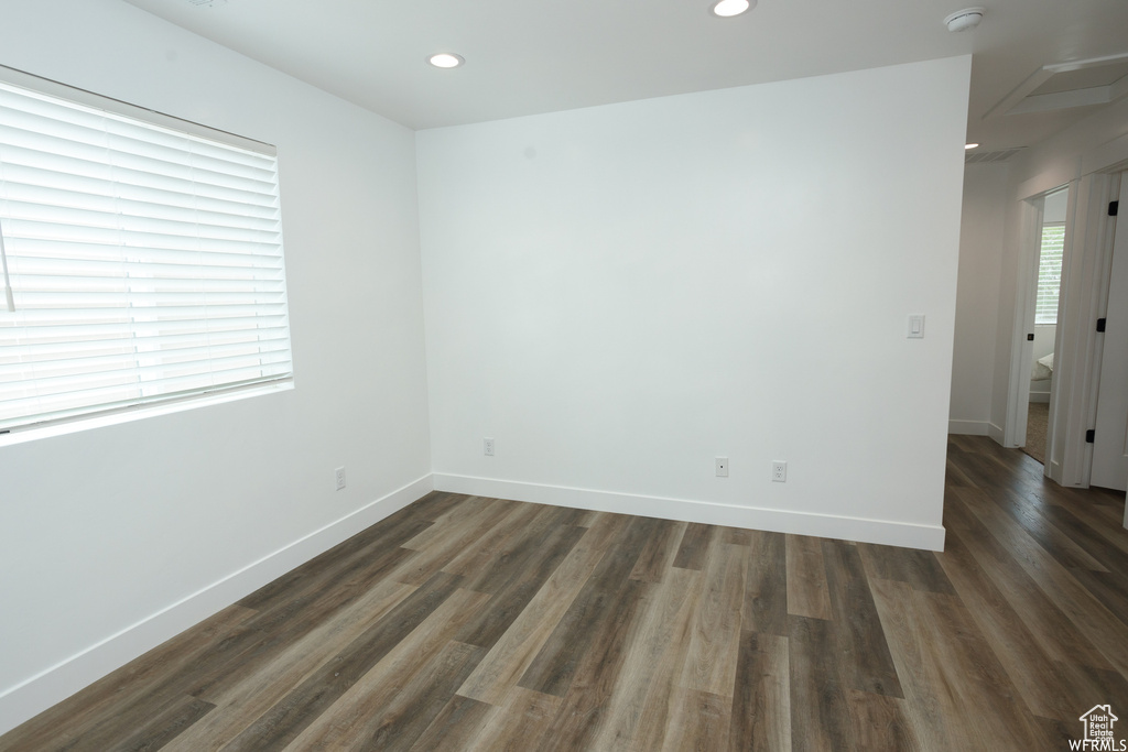 Unfurnished room with dark hardwood / wood-style flooring