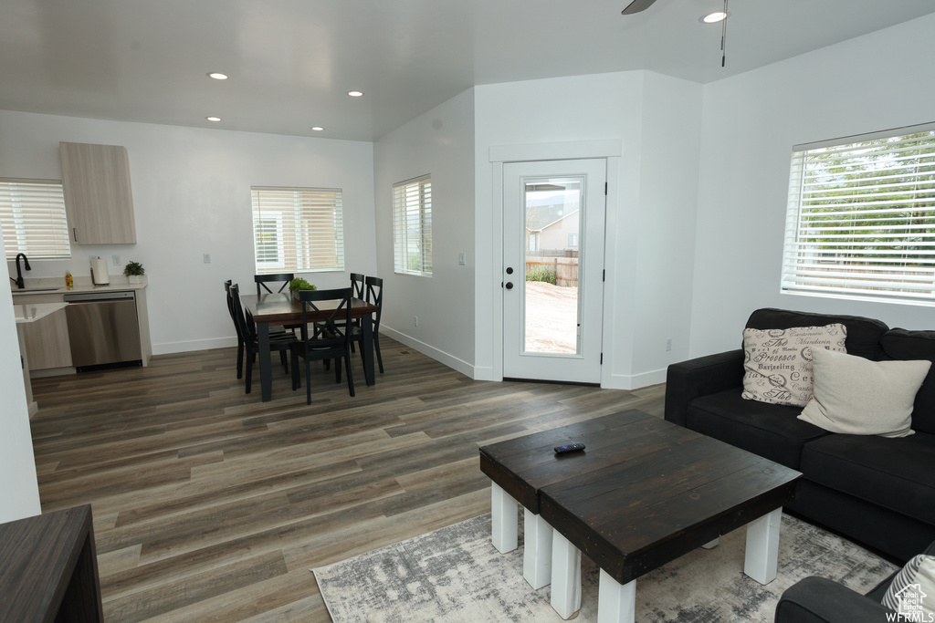 Living room with sink, ceiling fan, and hardwood / wood-style floors