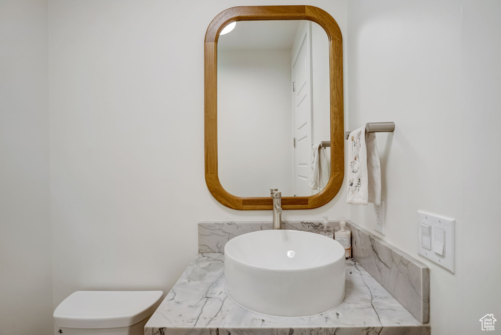 Bathroom featuring sink and toilet