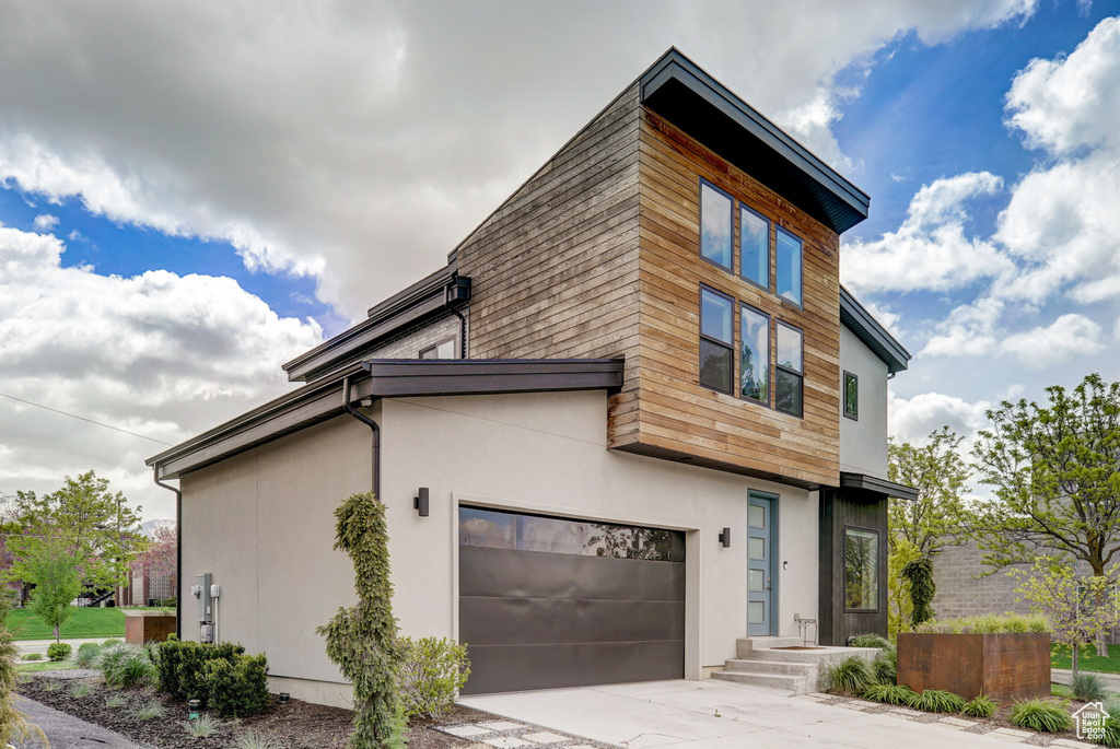 Contemporary home featuring a garage