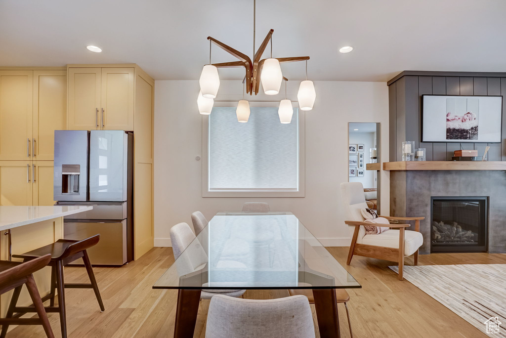 Dining space with light hardwood / wood-style floors