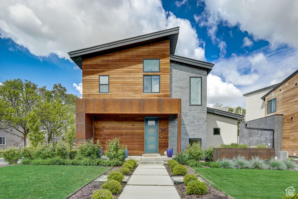 Contemporary home with a front lawn