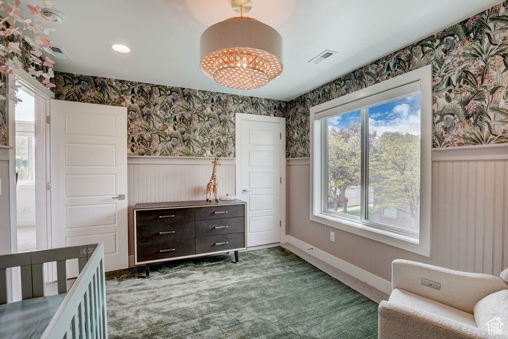 Sitting room featuring carpet floors