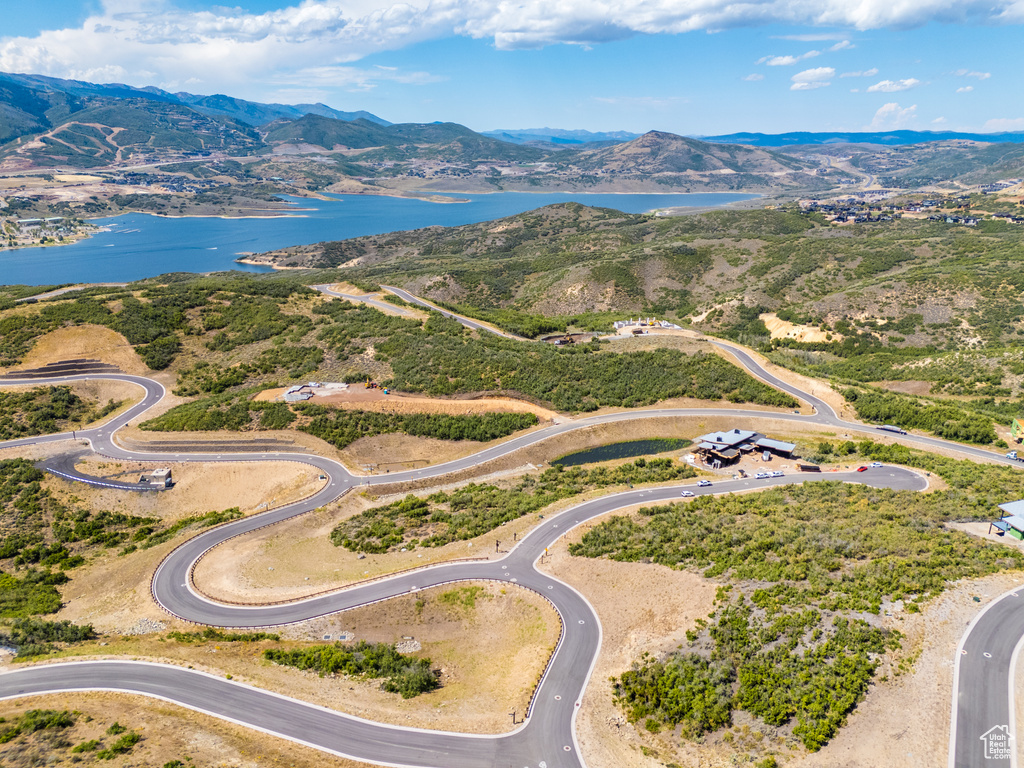 Aerial view featuring a water and mountain view