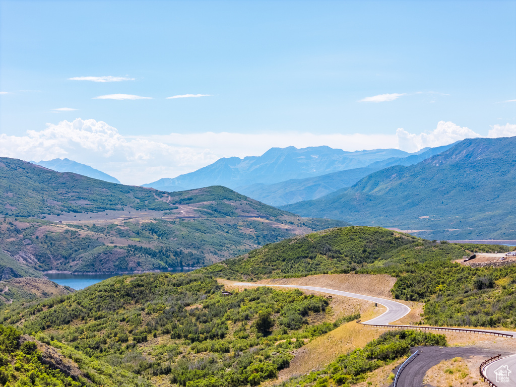 Property view of mountains with a water view