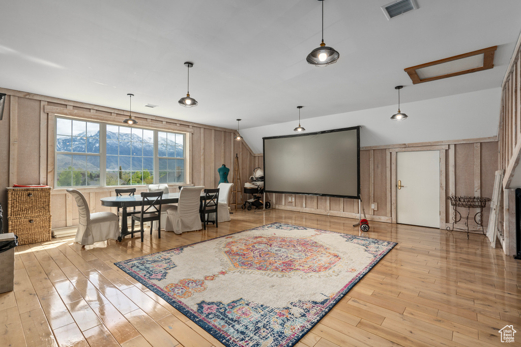 Living room featuring a mountain view and light hardwood / wood-style flooring