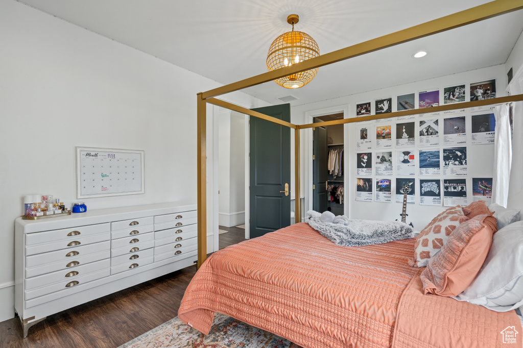 Bedroom featuring dark hardwood / wood-style floors