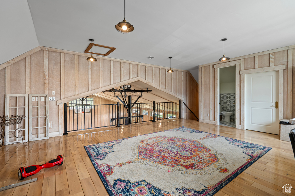 Interior space with wood-type flooring and wood walls