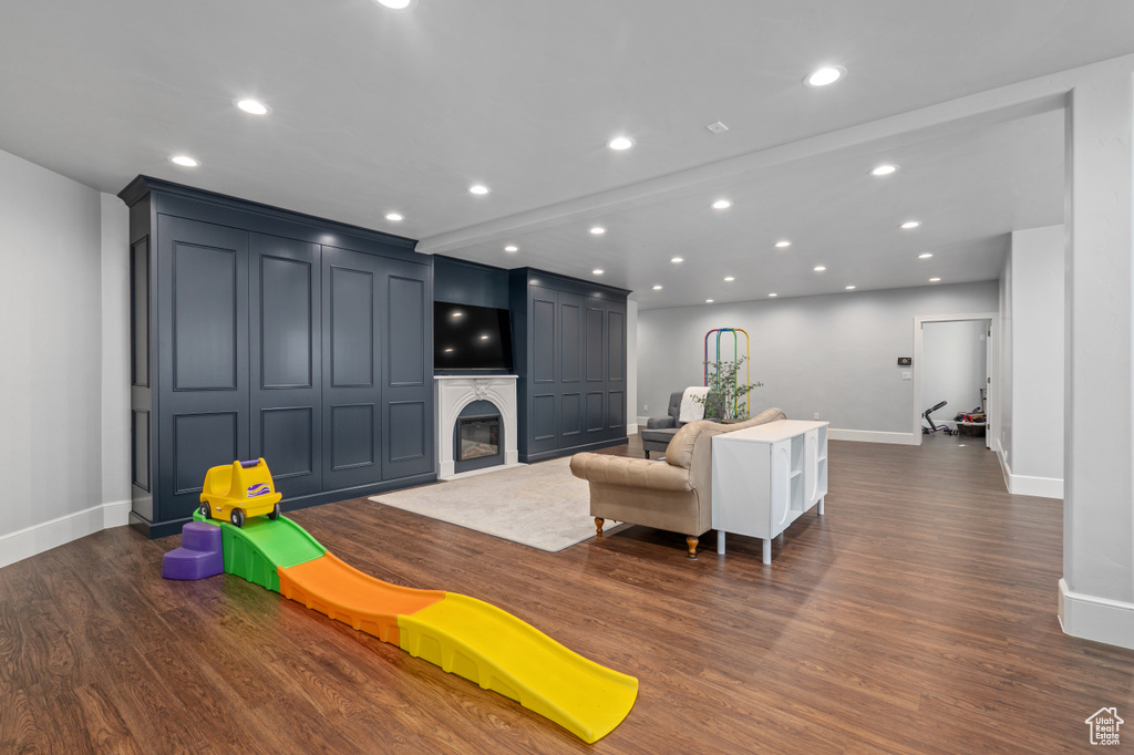 Recreation room featuring dark wood-type flooring